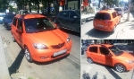Mazda demio редкого оранжевого окраса.
